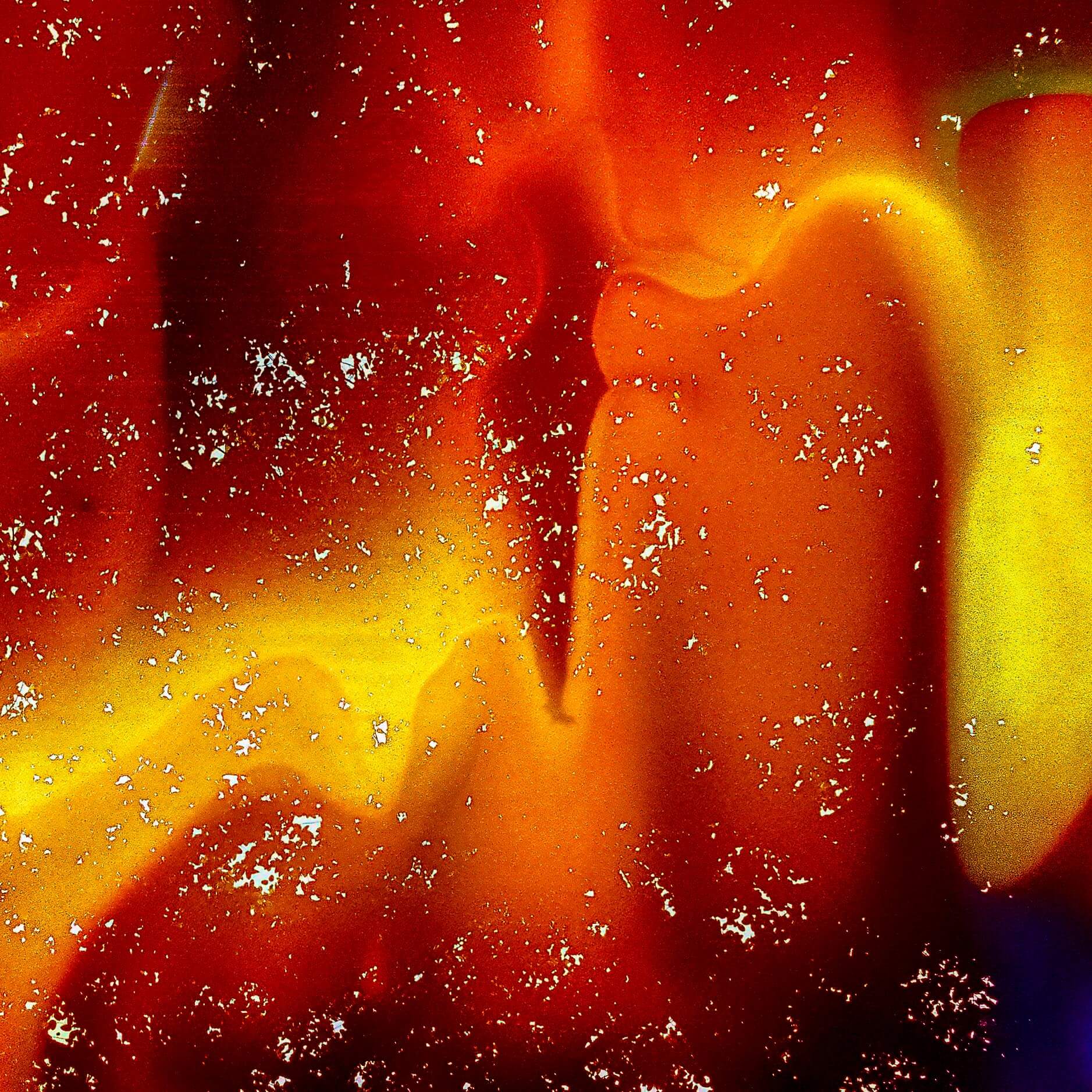 This image shows "Flaming," an artwork with bright reds, oranges, and yellows, and specks of white like sparks in a fire, evoking strong emotions and the warmth of flames.
