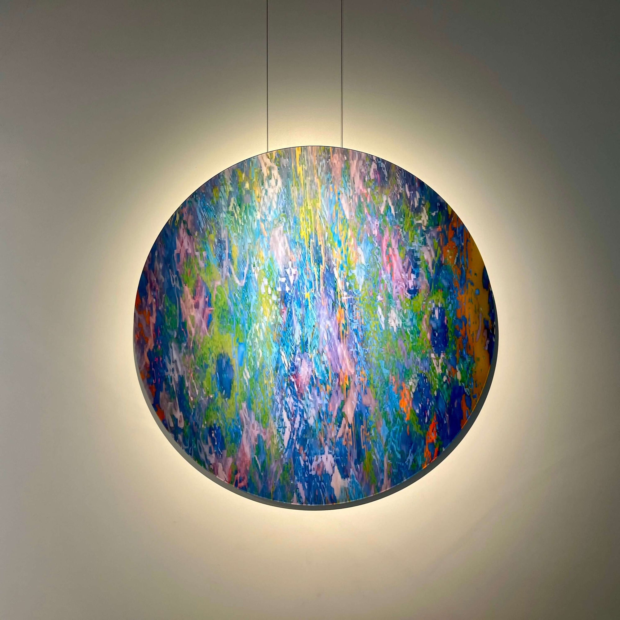 Abstract circular artwork titled 'Continuity' by artist Bryce, featuring vibrant colors and layered textures.