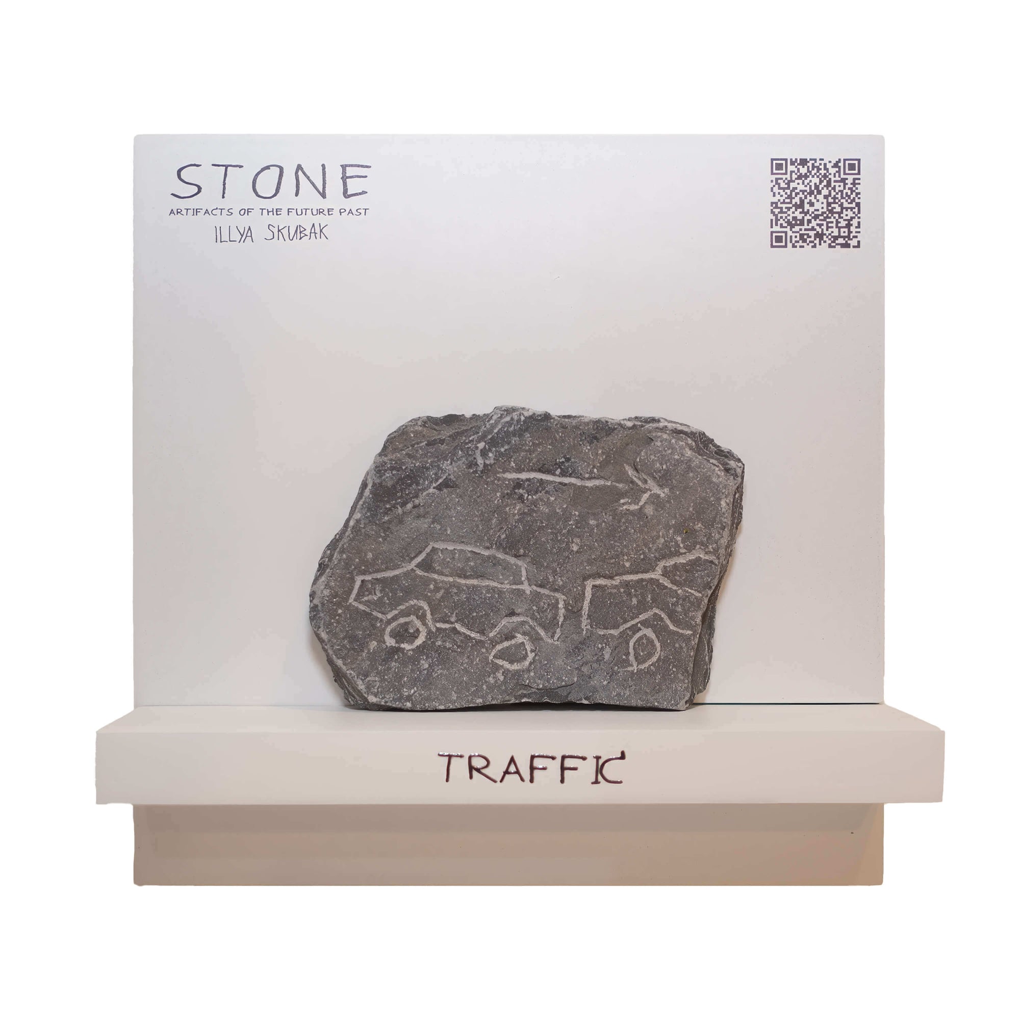 Stone art piece titled 'Traffic' by Illya Skrubak, depicting ancient vehicles on a grey stone slab.