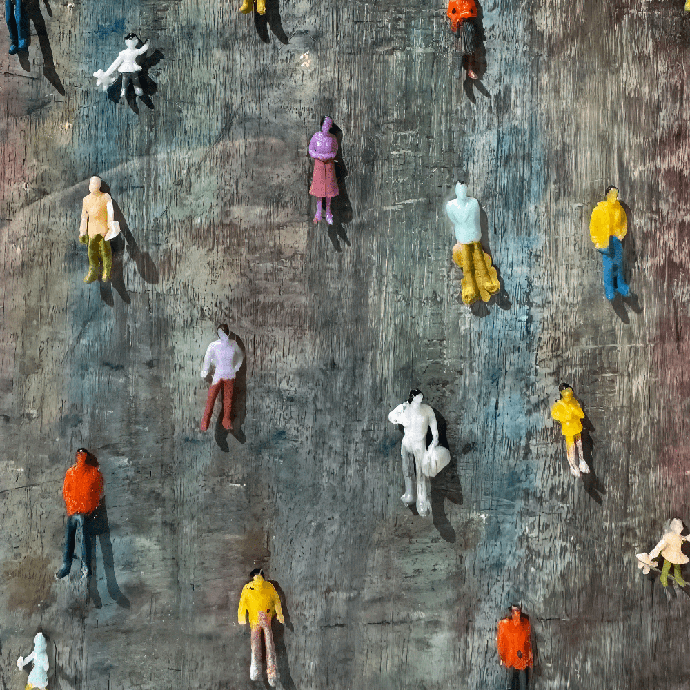 Mixed media artwork featuring miniature figures on a layered surface in abstract colors, part of 'Imperfection' by artist Bryce.