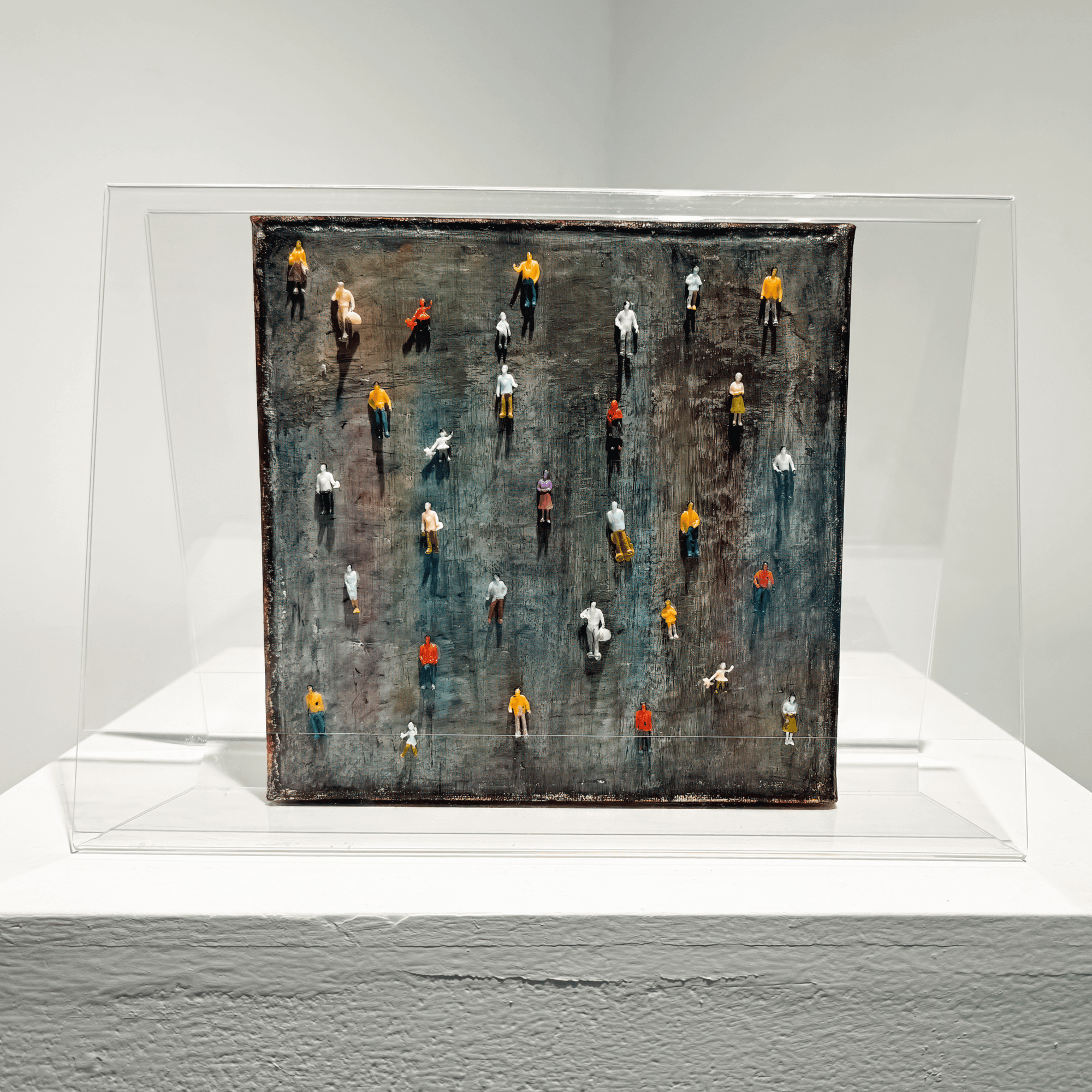 Mixed media artwork 'Imperfection' by BRYCE, featuring miniature figures in a transparent casing.