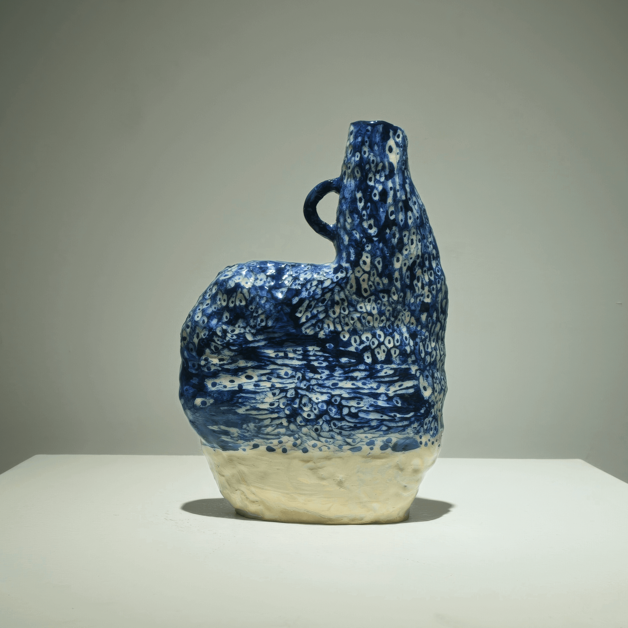 Abstract ceramic art piece by Supmanee Chaisansuk, featuring cobalt oxide glaze in a free-standing form.