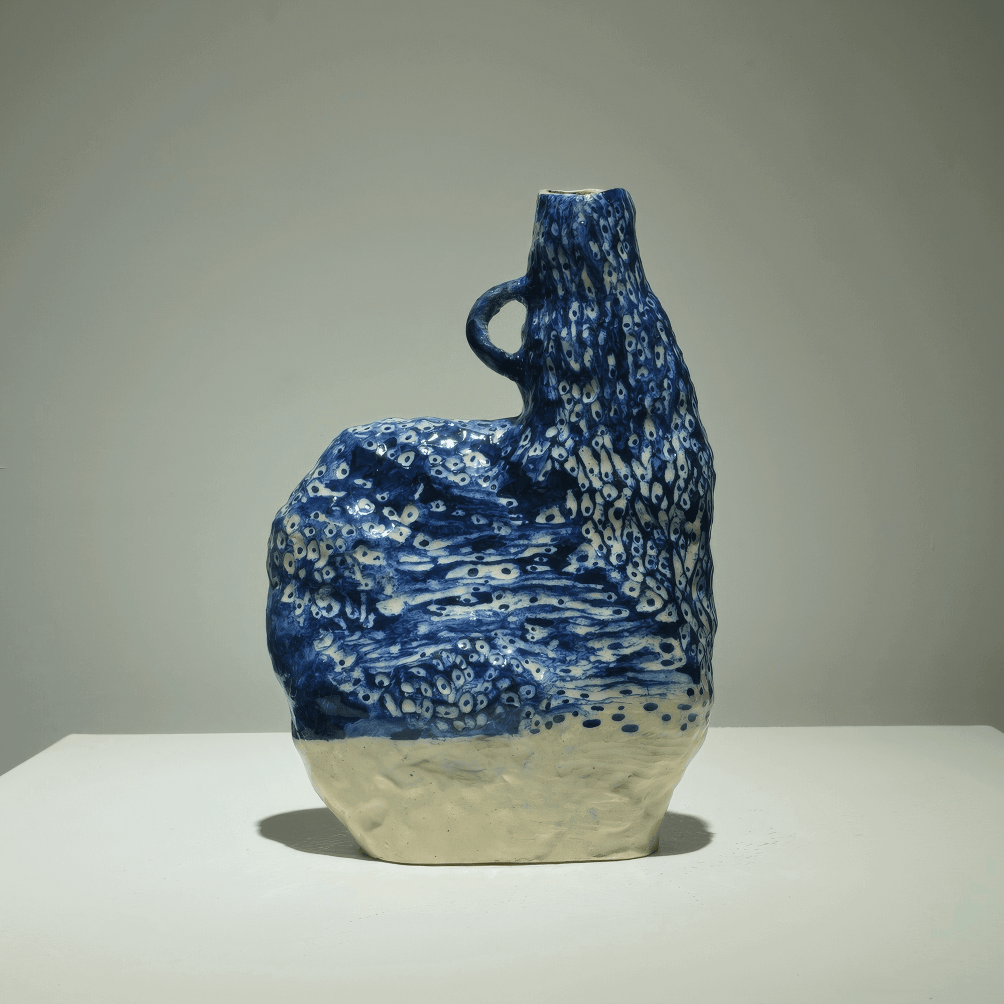 Hand-sculpted ceramic vase by Supmanee Chaisansuk, featuring abstract cobalt oxide patterns, 2020.