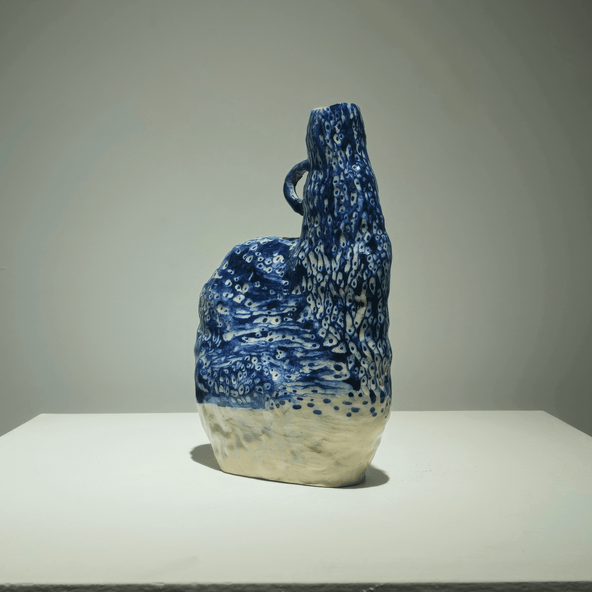 Abstract ceramic artwork 'Life' by Supmanee Chaisansuk, featuring cobalt oxide glaze and smooth surfaces.