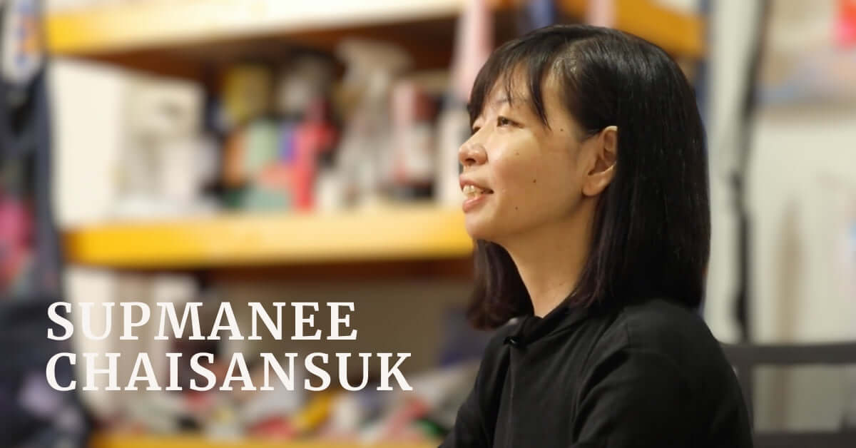 Portrait of Supmanee Chaisansuk in her studio, showcasing her passion for art and nature.