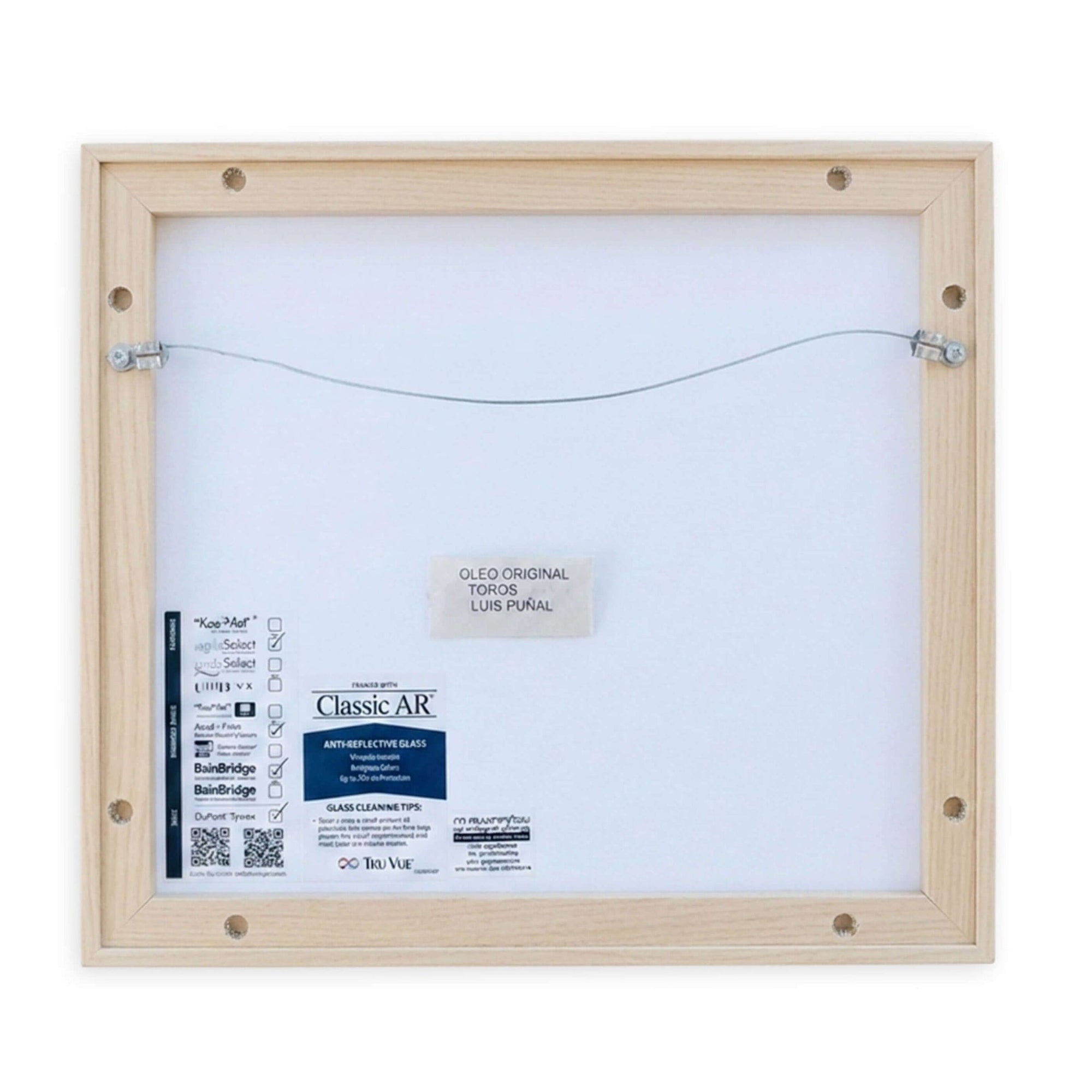 Back view of Toros (Undated) by Luis Puñal, featuring wooden frame and label on the canvas.