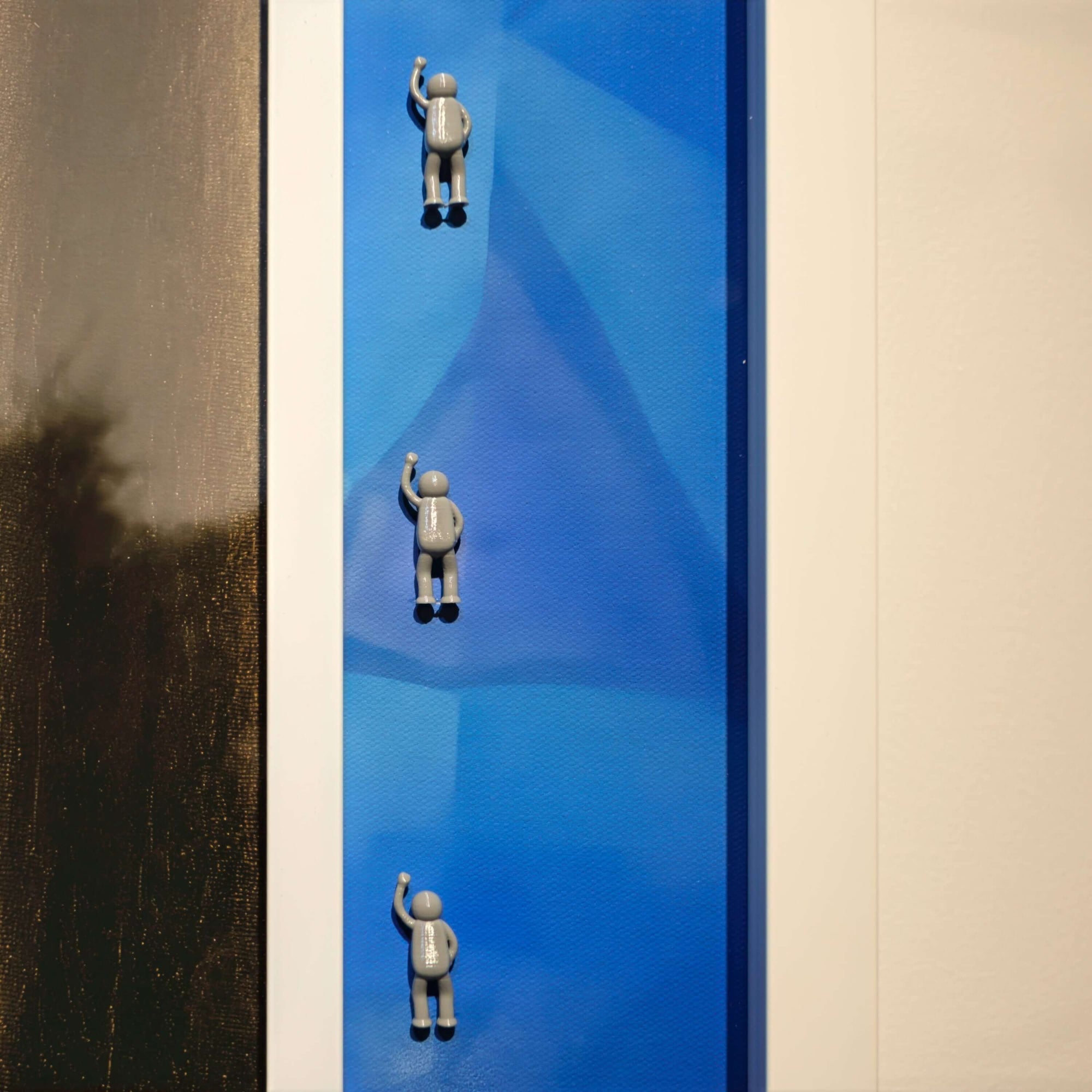 Rhythm of the Frame, 2025 artwork featuring three small figures climbing a blue textured surface.