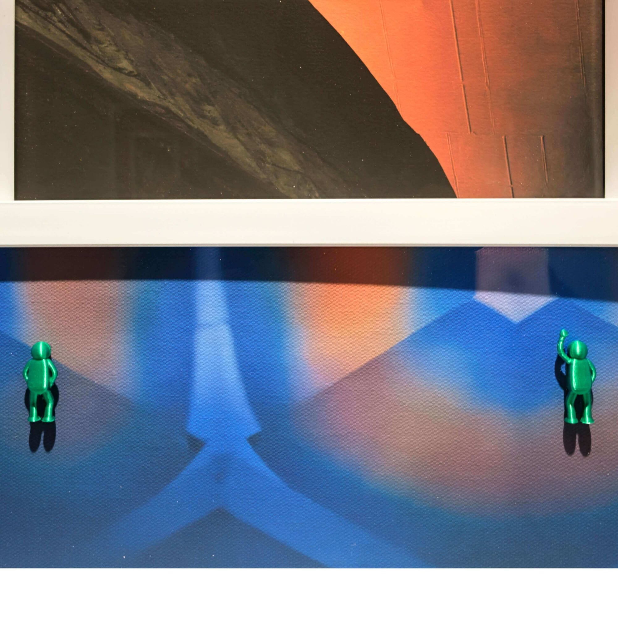 Colorful art piece featuring miniature green figures against a vibrant abstract background, titled Spiral Inward, 2025.