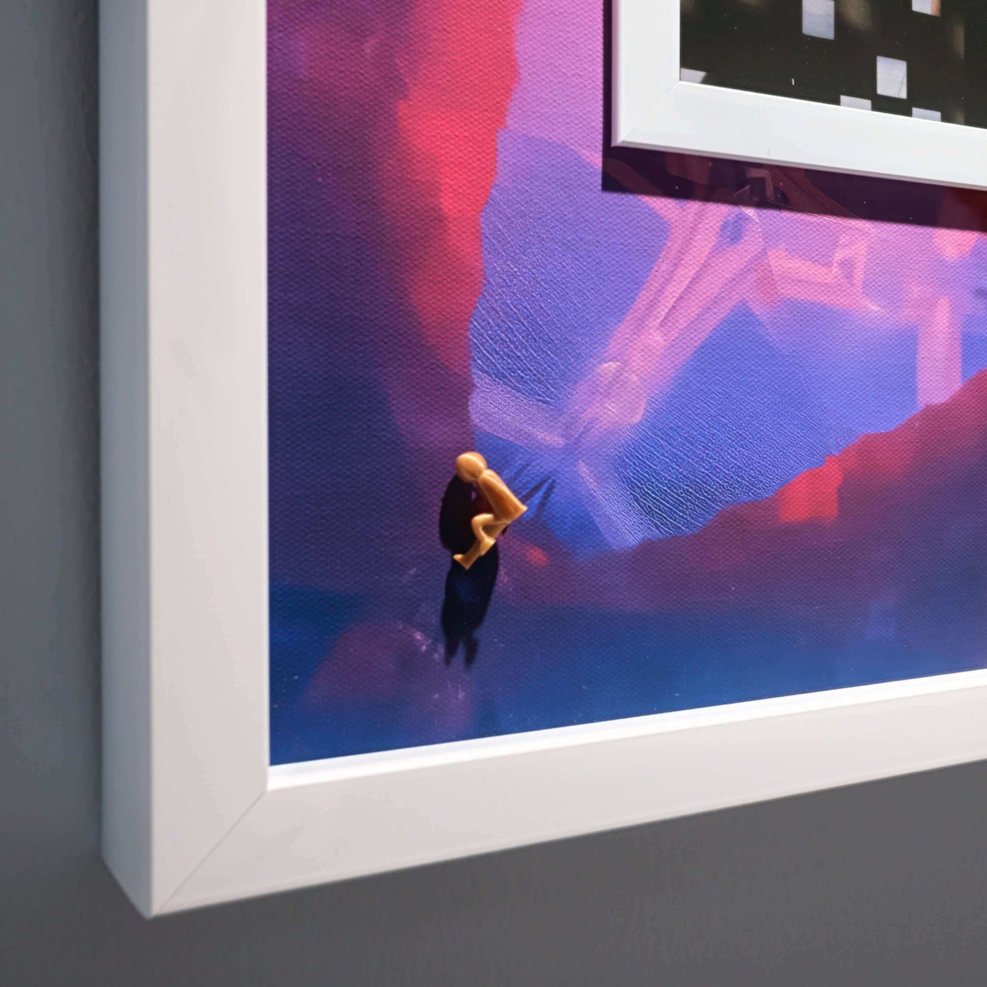 An artistic print titled 'Scattered Colours, 2025' featuring vibrant colors and a small figurine.