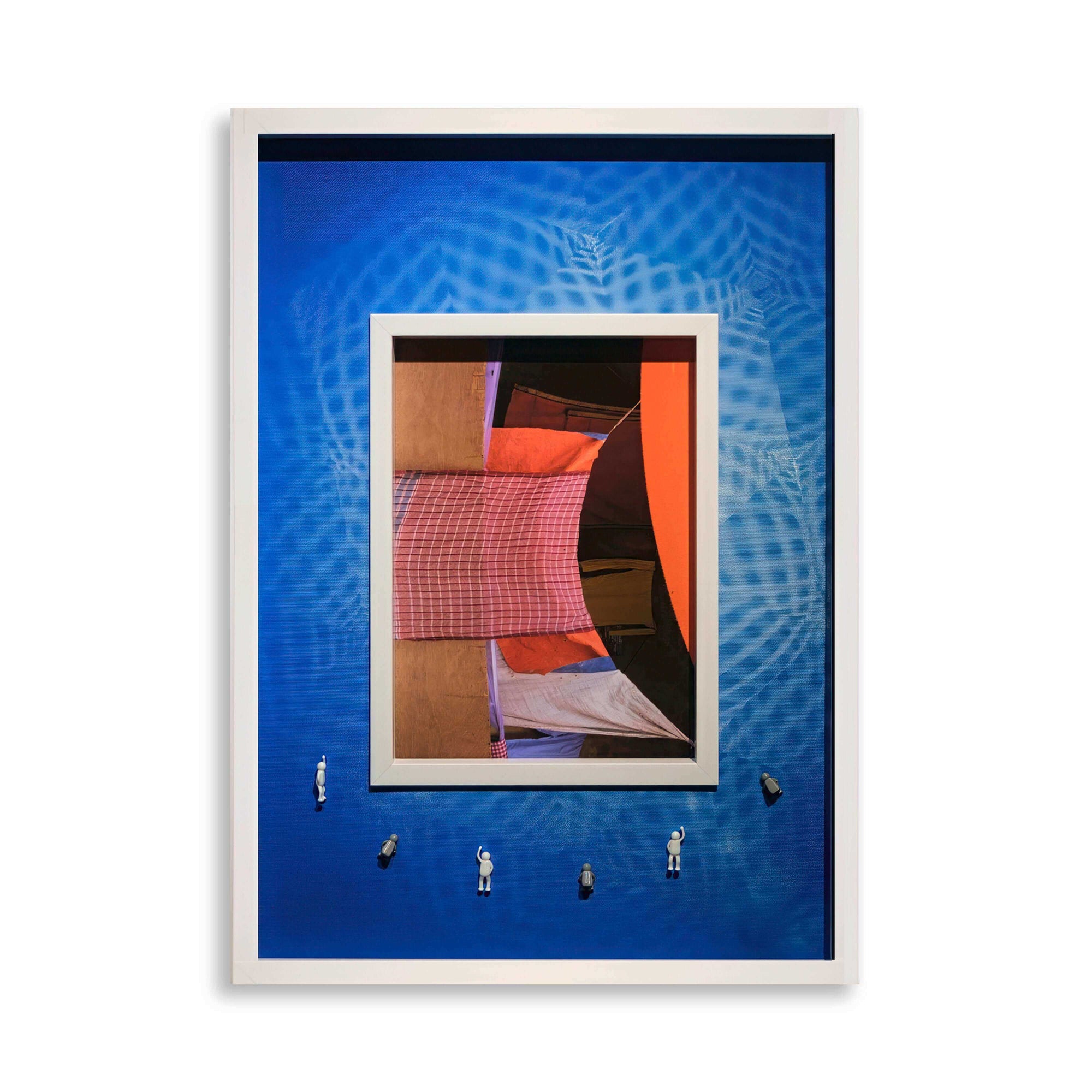 Covered Memory, 2025: abstract artwork featuring layered fabrics and miniature figures on a vibrant blue background.