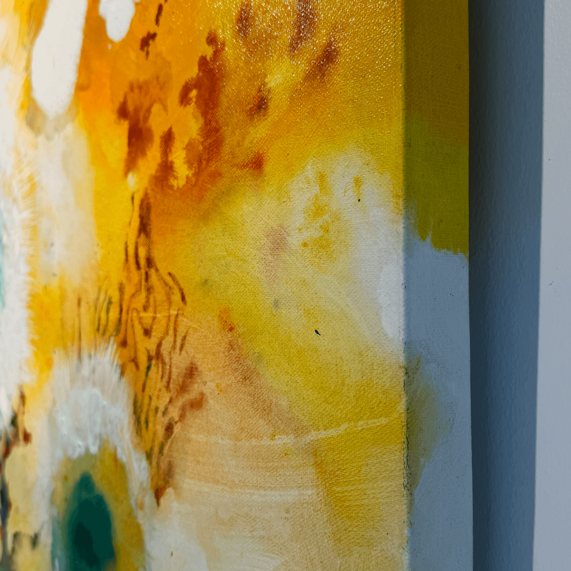 Side view of Supmanee Chaisansuk's abstract painting titled "Decay Is Beautiful 02," showcasing textured yellow, white, and green hues on canvas.