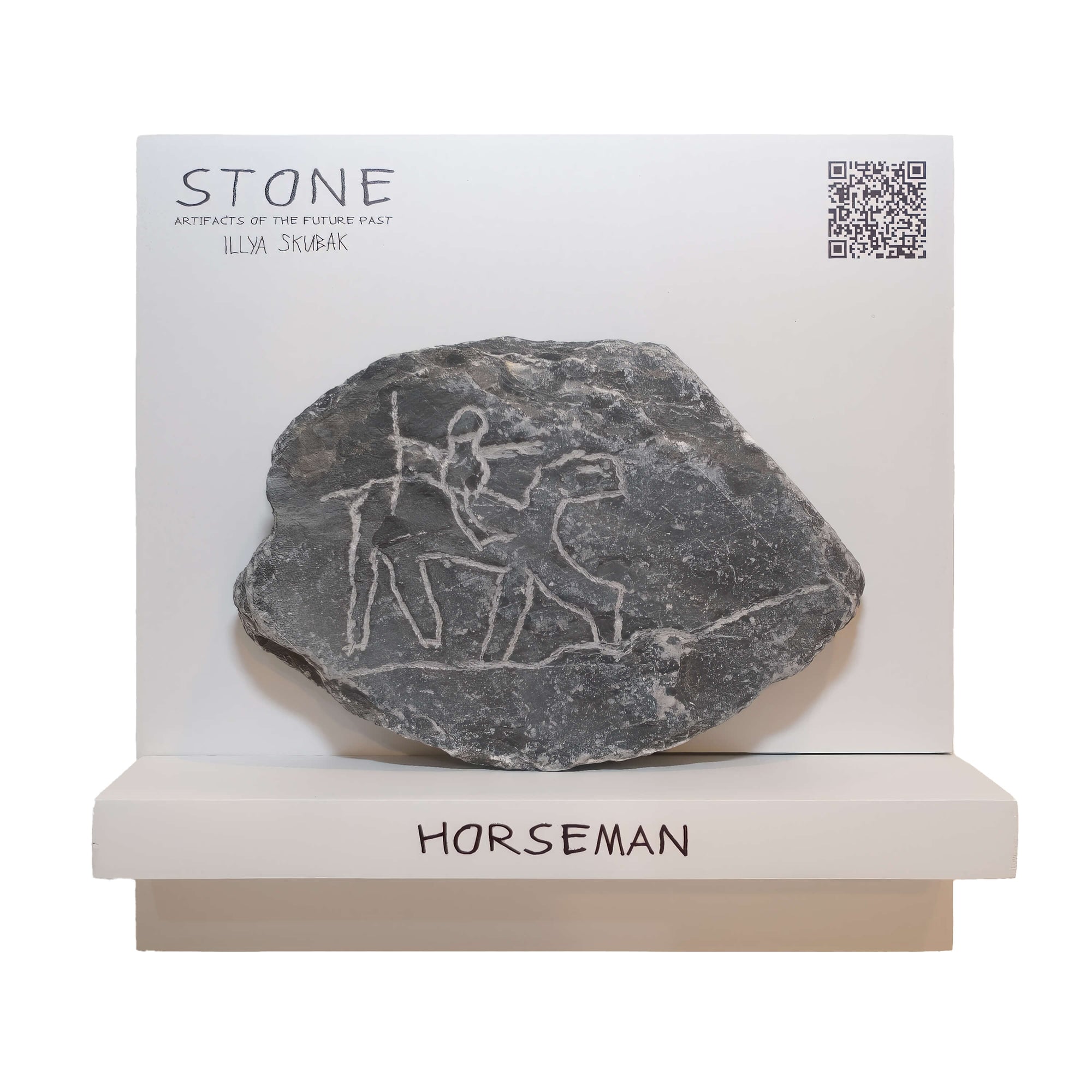 Horseman stone artifact depicting an ancient horseman carving on slate.