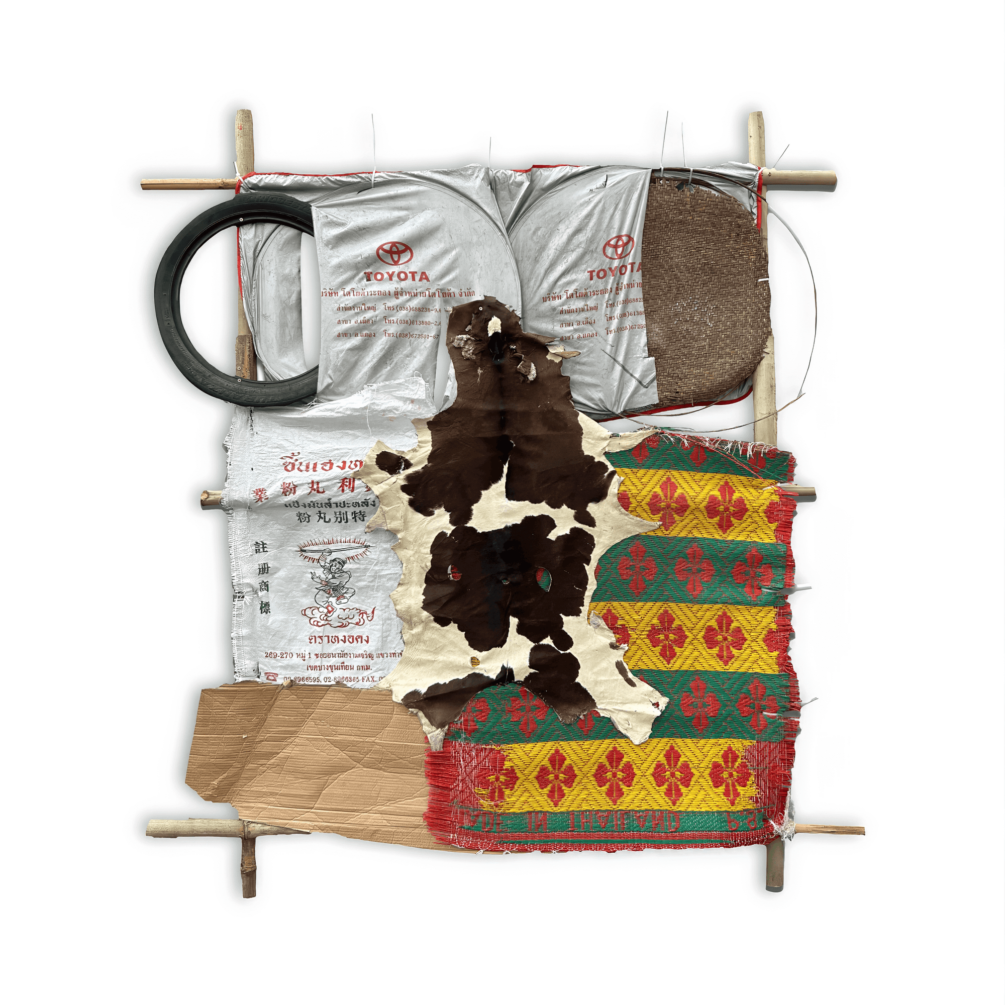 Artistic composition of recycled materials including fabric, paper, and metal, showcasing sustainability and creativity.