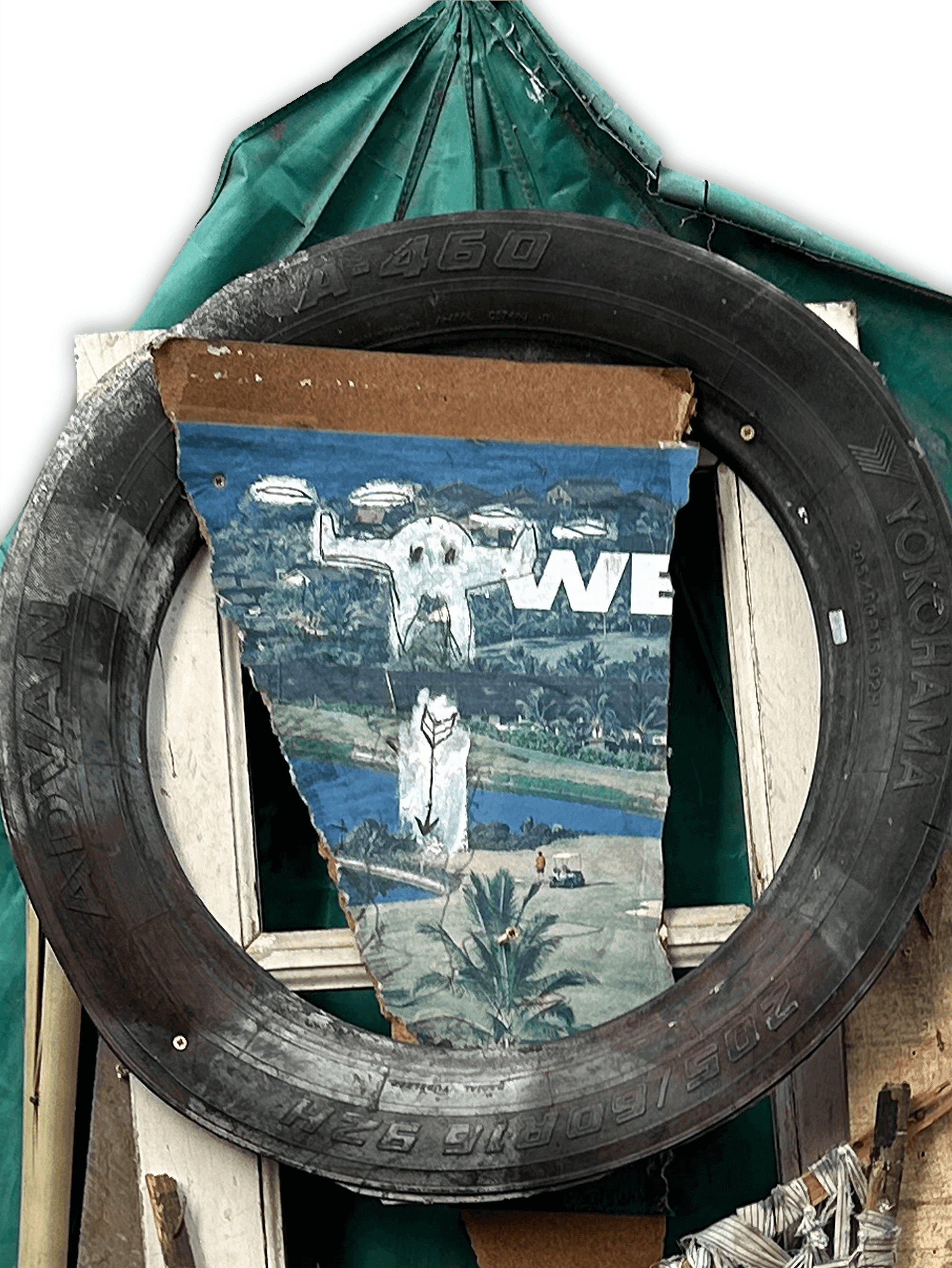 Circular tire frame displaying a mixed media artwork featuring a palm tree landscape and the word 'WE'.