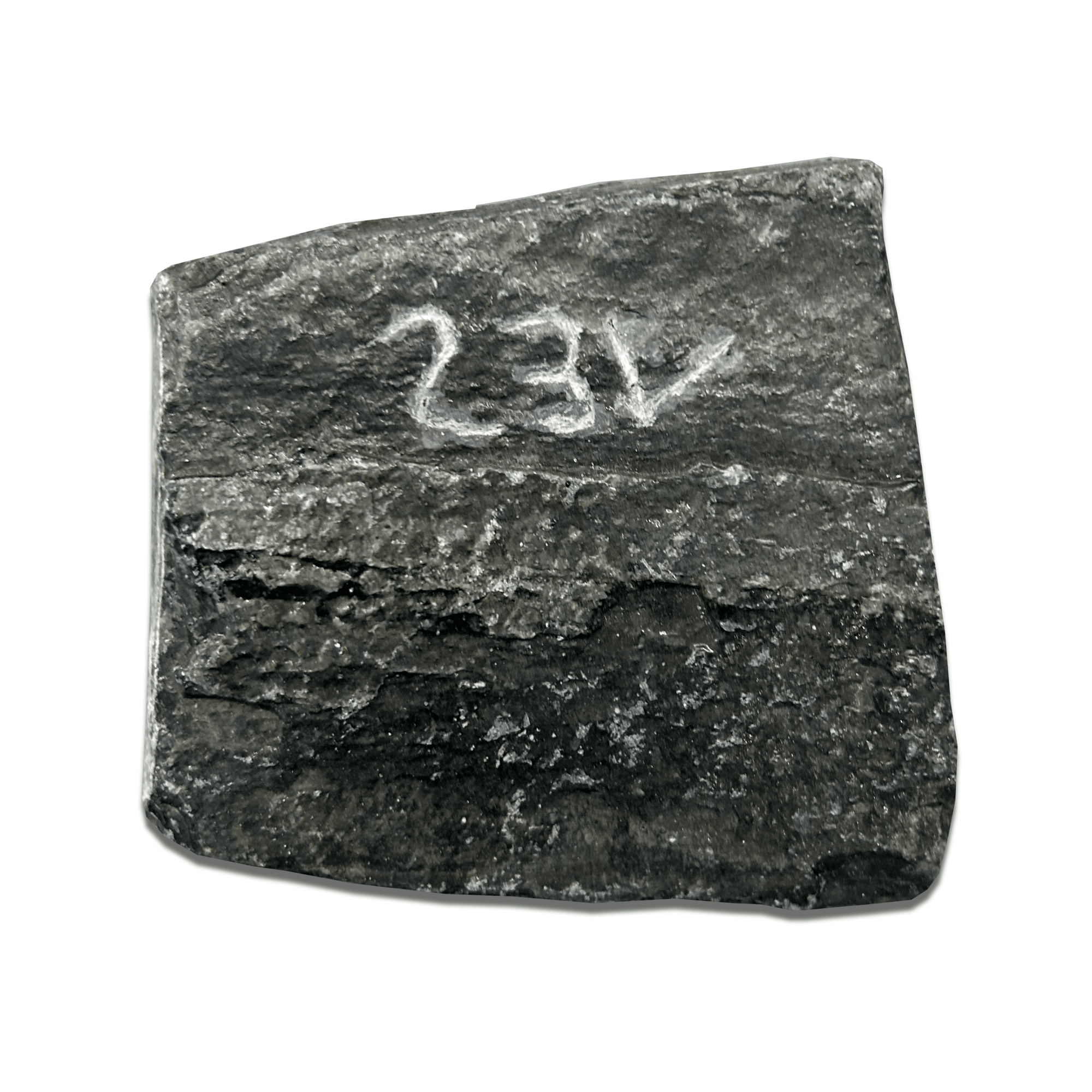 Dark textured stone with a white engraved number '23V' on its surface.