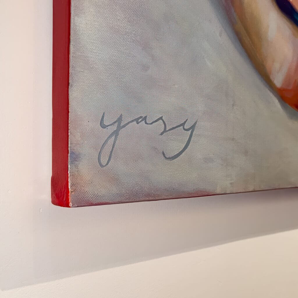 Signature of artist Yasy Bachurina on a canvas edge of an abstract surrealism artwork.