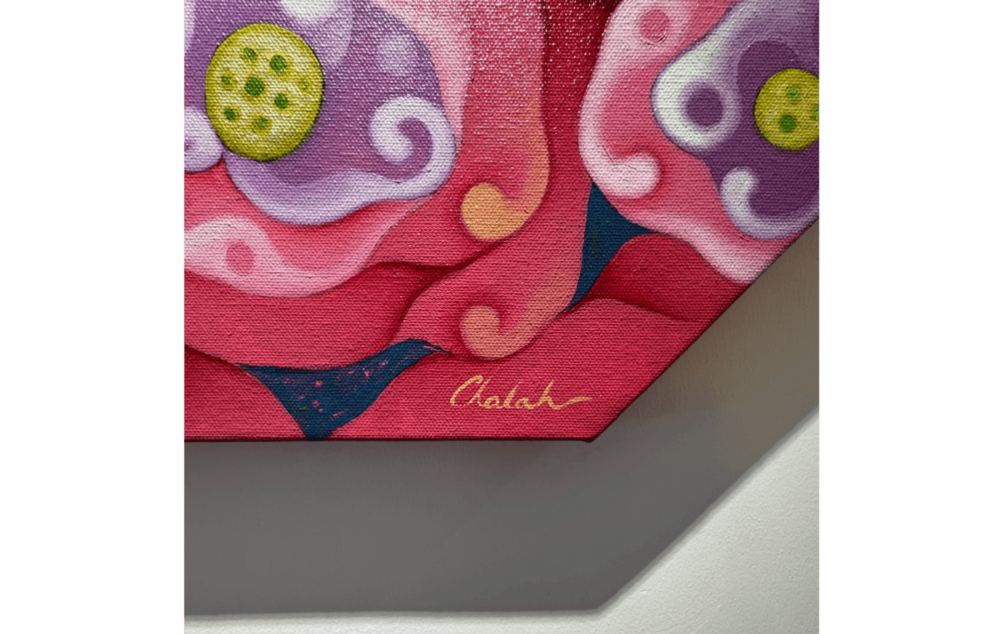 Close-up of the signature on Pink Lotus (2022) by Chalah Chaveesuk, showcasing vibrant floral details.